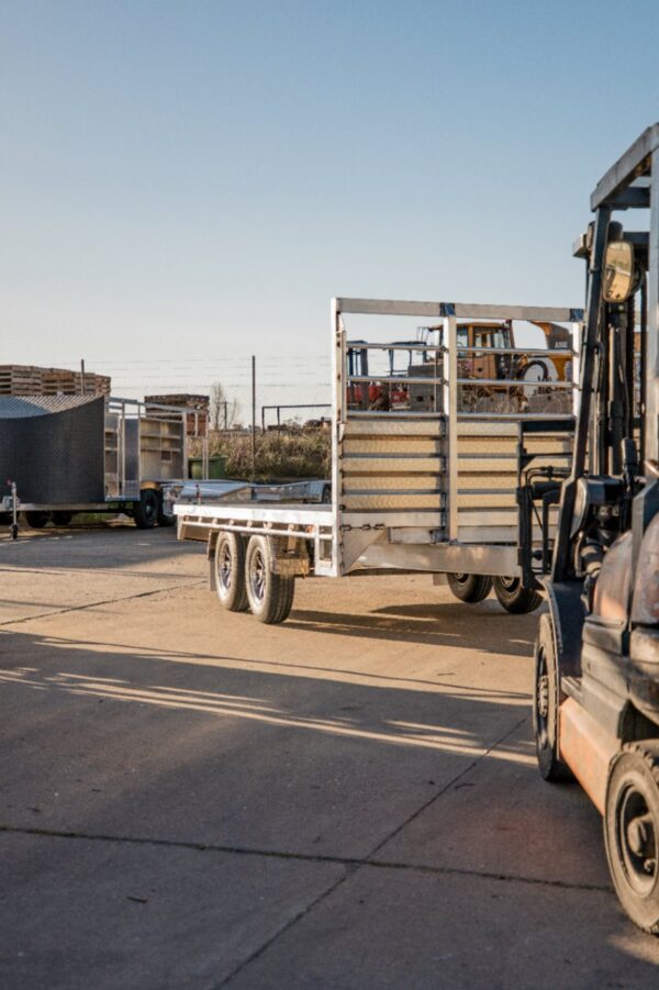 Trailer Parked Beside a Forklift — Exclusive Trailers in Kelso, NSW
